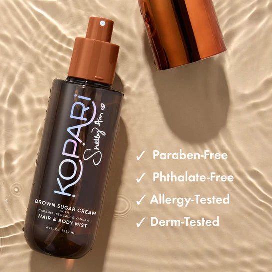 Kopari x Shelby Ann Brown Sugar Cream Hair & Body Mist with caramel and s'mores backdrop